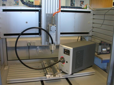 Figure 5: Large bed &micro;FSW machine at TWI with supplementary radiant heating delivered by fibre to the &micro;FSW head