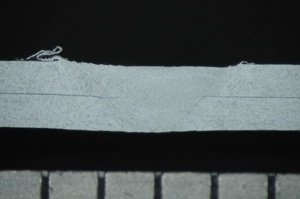 Figure 8: Lap weld between two 300&mu;m thick sheets of aluminium alloy - Cross section of weld
